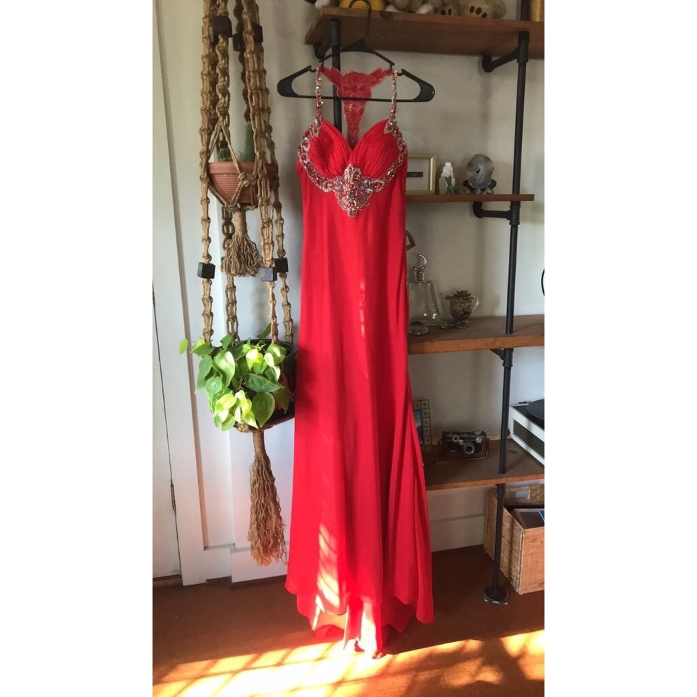 Full length formal gown with beaded detail.